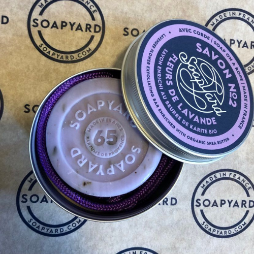 soapyard soap on a rope perfect as a travel soap, shown is a lavender soap in an aluminium travel tin, perfect eco-friendly toiletry for sustainable travel