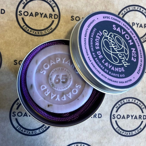 soapyard soap on a rope perfect as a travel soap, shown is a lavender soap in an aluminium travel tin, perfect  eco-friendly toiletry for sustainable travel 