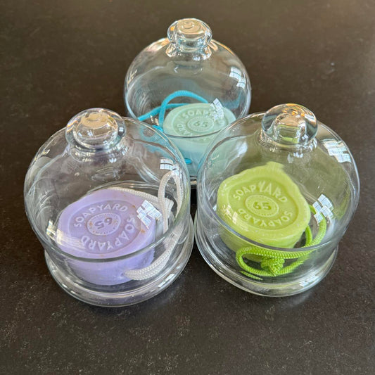 3 glass domes with soaps and ropes inside