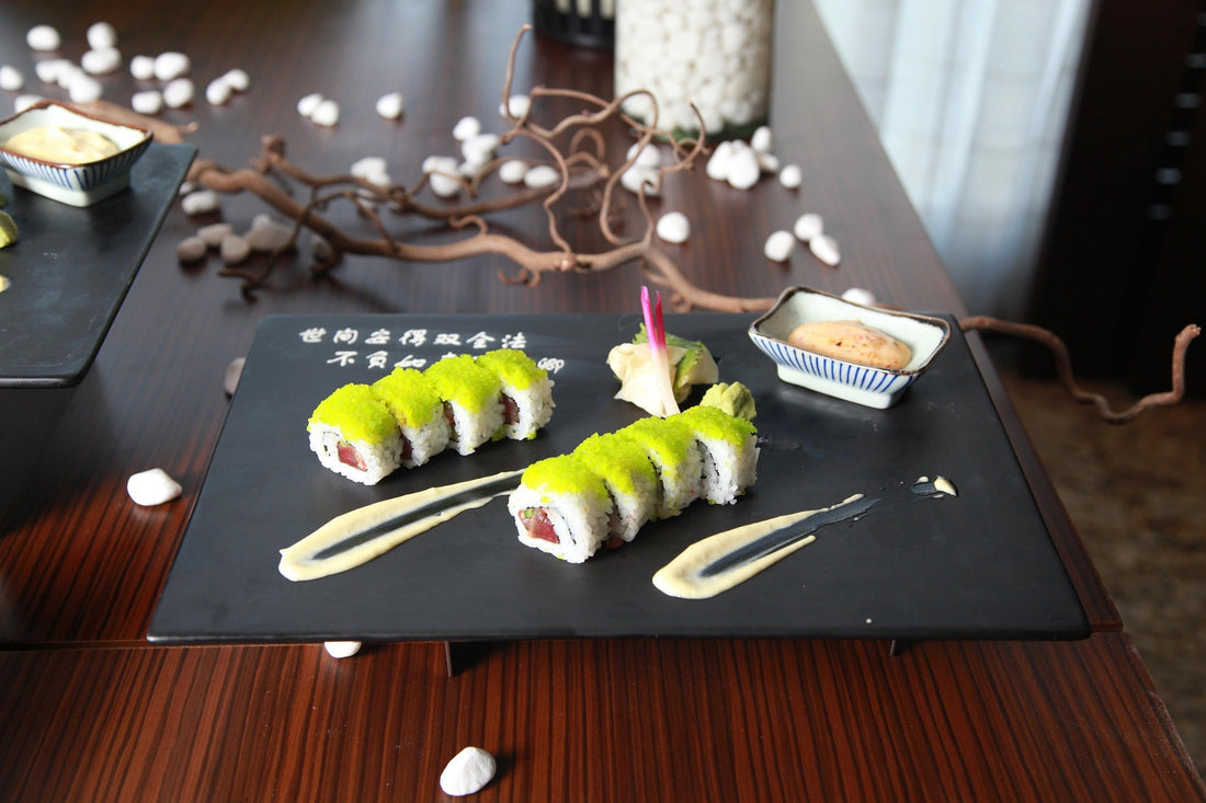 A spoon filled with bright green wasabi paste resting on a wooden surface. This paste represents the common horseradish-based wasabi substitute often served outside of Japan.